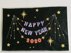 a happy new year banner hanging on the wall