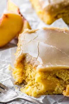 a piece of cake sitting on top of foil next to a slice of apple pie