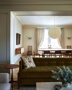 a living room filled with furniture and a table