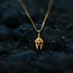 Channel the warrior spirit with our gold Spartan helmet pendant, meticulously crafted in the USA. Symbolizing strength, honor, and valor, these pieces are designed for those who embody the fearless spirit of a Spartan. PENDANT INFORMATIONThis pendant is made of real, solid gold.• Made in USA• Size: Mini• Material: 14k or 18k solid gold• Finish: polished• Height: 1.15" (29 mm) | *includes the small circle, bail dimensions not included • Width: 0.6" (14,5 mm)• Pendant weight (approx.): 3 grams (14 Engraved Warrior Style Pendant Jewelry, Warrior Style Engraved Pendant Jewelry, Spartan Helmet, Inner Warrior, Warrior Spirit, Small Circle, The Warrior, Gold Finish, Gold Pendant