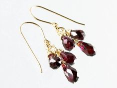 Garnet earrings Gold filled earrings deep red gemstone | Etsy Elegant Red Jewelry For Birthday, Garnet Drop Jewelry For Gift, Gift Garnet Drop Jewelry, Burgundy Teardrop Jewelry For Gifts, Red Cluster Earrings Gift, Ruby Cluster Jewelry Gift, Gemstone Dangle Cluster Earrings As Gift, Red Briolette Earrings For Anniversary, Garnet Dangle Birthstone Jewelry