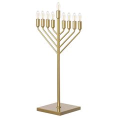 a golden menorah with five candles on it's base and four smaller candles in the middle