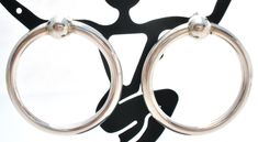 Fine Jewerly - This is a pair of sterling silver pierced round circle earrings. They are 1.25" in diameter, earrings not marked but tests for sterling, earring backs are hallmarked 925, weight is 6.2 grams.