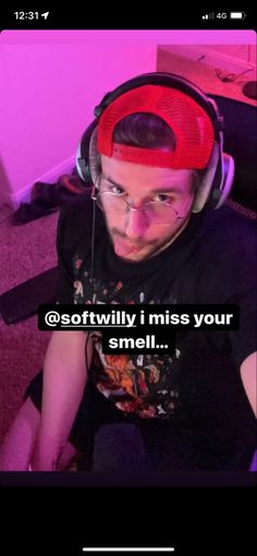 a man with headphones on sitting in front of a computer keyboard and text that reads, sotwiliv i miss your smell smell smell smell