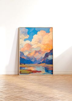 a painting is hanging on the wall in an empty room with hard wood flooring