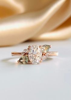 an engagement ring with three pear shaped diamonds