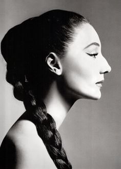 black and white photograph of a woman's face with her hair in a braid