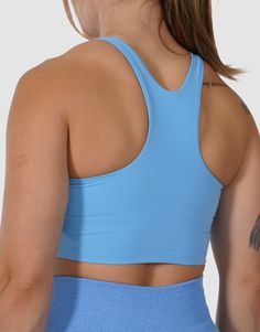 Experience the perfect blend of support and comfort with our racerback Sports Bra. Designed to complement your active lifestyle, this womens sports bras offers a lightweight and breathable design that keeps you feeling at your best. The comfortable built-in bra, the removable paddings ensure and the supportive straps ensure you can conquer your workouts with confidence and no distractions. Whether you choose to layer it under your favorite top or wear it alone with leggings or shorts, our sports Sporty Racerback Crop Top With Built-in Bra, Sporty T-back Crop Top For Workout, Supportive Blue Sports Bra With Built-in Padding, Solid Color Sports Bra With Built-in Bra, Racerback, Athleisure T-back Sports Bra With Seamless Construction, Sporty Seamless T-back Sports Bra, Sporty High Stretch Crop Top With Built-in Padding, Sports Bra With Light Support And T-back, Athleisure Sports Bra With Built-in Padding, T-back