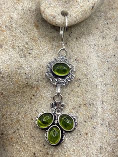 Delicate and detailed hand set Antique and Silver lever back earrings  Genuine green peridot  These dangle earrings are over an inch long All jewelry is shipped free in the US in a nice gift box.   Check out our over a THOUSAND great reviews  PLEASE NOTE If we have multiples of the same vintage item, it is because we often purchase factory remnants or odd lots. Likewise, if you have a product to sell, please reach out! All the best, Nemesis team Biker Rings Mens, Cowboy Wedding, Chunky Earrings, Silver Dangle Earrings, Green Peridot, Etsy Earrings Dangle, Silver Earrings Dangle, Vintage Charms, Antique Vintage