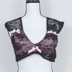 Sugar Thrillz Grace In Lace Satin Bow Crop Top Black/Pink Size Large Bralette Out Of Stock Online Nwot Sugar Thrillz Grace In Lace Satin Bow Crop Top We’re Having Tulle Much Fun. This Crop Top Has A Floral Lace Overlay, Super Cropped Fit, And Satin Bow Details Around The Bust. New Without Tags Sizing For Large Bust: 37-38 Waist: 29-30 Party Pink Bra With Lace Trim, Pink Lace Bra With Lace Trim, Pink Lace Feminine Bra, Feminine Pink Lace Bra, Rainbow Crop Top, Acid Bath, Butterfly Tank Top, Cold Shoulder Crop Top, Bow Crop Tops