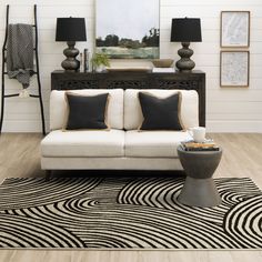 Abstract arching black lines boldly are layered over a modern neutral space-dye canvas in the contemporary design of the Bobby Berk's Remolino Area Rug. A creative collaboration between design guru, Bobby Berk, and a renowned luxury flooring maker, the curated styles of this collection mix legendary craftsmanship with hip, urban style. Ideal for enchanting entryways, living rooms, bedrooms, offices, dining areas and more, the patterns of this collection reflect Bobby Berk’s signature style, infused with a youthful spirit that perfectly fits any lifestyle. Thoughtfully rendered with a blend of the finest quality yarns, this collection is designed to beautifully wear overtime for an enduring elegance that lasts. Bobby Berk 9 X 12 (ft) Onyx Indoor Geometric Mid-century Modern Area Rug Polyest Creative Collaboration, Bobby Berk, Karastan Rugs, Modern Room Divider, Luxury Flooring, Geometric Inspiration, Living Room Partition, Colored Background, Rug Direct