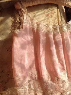 "very, very beautiful pink silk and lace antique camisole 1880s size M/L soft silk fabric with delicate lace and pink silk ribbons Along the neck line the ribbon is a bit to short to wear in a larger size. I also saw a slightly underarm discoloration no weak era's in excellent condition bust 40\" or smaller 102 cm or smaller waist 32\" or smaller 82 cm length 18\" 46 cm" Pink Silk Spaghetti Strap Camisole, Feminine Pink Silk Camisole, Pink Silk Camisole For Summer, Pink Lace Trim Camisole With Spaghetti Straps, Pink Summer Camisole With Delicate Lace, Pink Camisole With Lace Trim And Spaghetti Straps, Pink Feminine Camisole With Ruffles, Summer Pink Camisole With Delicate Lace, Summer Pink Lace Camisole