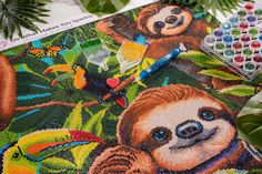 a painting of a sloth in the jungle with paintbrushes and markers