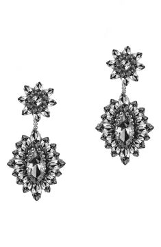 Exude extreme sparkle in these tonal crystal drop earrings anchored by floral clusters sure to make a glamorous statement. 2" drop, 1" width Post back Steel post back Goldtone plate/leather/glass/cotton Imported Holiday Capsule Wardrobe, Deepa Gurnani, Holiday Lookbook, Packing Clothes, Faux Wrap Top, Ivory Earrings, Steel Post, Fuchsia Color, Crystal Drop Earrings