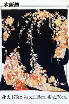 This hon furisode (long-sleeved kimono) is made of black silk and decorated with large cherry and plum blossoms on branch cherry blossoms and noshi (dried dried bonito). The plum and cherry blossoms are embroidered with gold pieces. It is a perfect piece for a festive occasion. Body length (from the shoulder): approx. 176.5 cm (body length cannot be taken out/impossible) Sleeve length: about 115.0 cm Length of sleeve: about 70.0 cm (the sleeve back cannot be made longer than the sleeve) Front width: approx. 24.5 cm / Back width: approx. 30.5 cm Material: Pure Silk Condition:Please see photos. ☆ Furisode" symbolizes youthfulness and glamour, and it is considered a garment to make oneself look beautiful. It is characterized by gorgeous designs with traditional Japanese patterns, expressing t Japanese Wedding Kimono, Long Sleeve Kimono, Japanese Wedding, Wedding Kimono, Gold Embroidery, Japanese Patterns, Japanese Kimono, Black Silk, Gorgeous Design