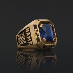 an image of a ring with a blue stone in the center on a black background