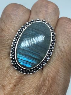 Vintage Blue Green Labradorite Stone Silver Ring https://www.etsy.com/listing/718463192/vintage-blue-green-labradorite-stone Vintage Oval Labradorite Jewelry, Blue Labradorite Rings For Gift, Blue Labradorite Rings As Gift, Blue Labradorite Rings For Gifts, Gift Blue Labradorite Rings, Vintage Labradorite Rings For Gift, Turquoise Moonstone Ring With Natural Stones As Gift, Vintage Moonstone Ring With Large Stone For Gift, Vintage Moonstone Ring With Large Stone As Gift