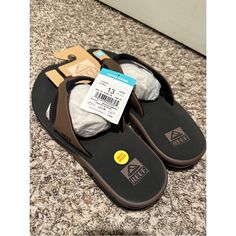 Nwt Reef Men's Fanning Sandals Brown Slip-on Flip Flops For Outdoor, Brown Synthetic Flip Flops For Outdoor, Brown Textured Footbed Flip Flops For Outdoor, Brown Textured Flip Flops For Outdoor, Brown Slides With Ortholite Insole And Round Toe, Brown Synthetic Slides With Cushioned Footbed, Brown Synthetic Flip Flops With Textured Footbed, Brown Synthetic Round Toe Flip Flops, Brown Flip Flops For Outdoor