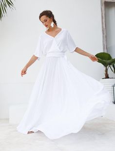 Editor Notes//A ravishingly romantic ensemble that can only be deemed as ethereal. There’s playful sophistication with this wrapped silhouette, one that excludes a youthful innocence. Designer Notes//Deep wrap v-neck bodice with 3/4 roll up sleeve and full circle maxi skirt. This dress is cut on the bias and consumed 10 meters of hand-dyed 100% cotton rayon blended fabric. DRESS COMES WITH SELF BELT.