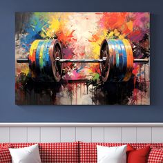 a colorful painting on the wall above a couch