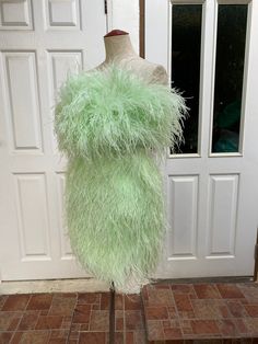 "Miki light green ostrich feather mini dress cocktail dress -Made to order -Please check my sizes chart before ordering -If it's doesn't fit with my size chart please measure your bust waist and hips -Dress made with ostrich feathers -Zipper closure on the back side -Straps can be taken off -Color: more than 18 colors -Dry clean only SGinstar Size Guide UK4/US0/EU32/AU4 Bust 31\"(78cm.) Waist24\"(60cm.) Hips33\"(83.5cm.) UK6/US2/EU34/AU6 Bust32\"(80.5cm.) Waist25\"(63cm.) Hips34\"(86cm.) UK8/US4 Green Mini Dress For Prom Season, Glamorous Green Mini Dress For Prom Season, Glamorous Green Mini Dress For Prom, Chic Green Mini Dress For Prom, Green Mini Length Prom Dress, Green Mini Dress For Cocktail And Prom Season, Feathered Fitted Mini Dress For Prom Season, Fitted Feather Mini Dress For Prom Season, Fitted Feather Mini Dress For Prom