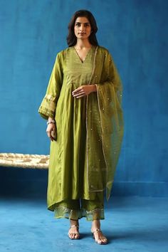 Green kurta with contrasting color panels, zari silk woven yoke, and dainty accents on the neck and sleeves. Paired with pant and checkered stole. - Aza Fashions Festive Fusion Style Silk Sets, Festive Fusion Silk Sets, Fusion Style Cotton Silk Dupatta In Traditional Drape, Festive Fusion Raw Silk Dupatta, Fusion Silk Set With Traditional Drape, Silk Fusion Set With Traditional Drape, Green Semi-stitched Cotton Silk Kurta, Green Semi-stitched Mulmul Kurta, Semi-stitched Green Cotton Silk Kurta