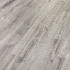 an image of wood flooring that looks like it has been painted in light grey