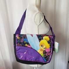 Disney Tinker Bell Black & Purple Mail Pouch Tinker Bell Crossbody Bag Tinkerbell Lap Top Bag Tinkerbell Crossbody Bag Tinker Bell Cross Body Bag Tinker Bell Back Pack New With Tags No Odors No Snags No Stains 120(E&P)(1220)(1021) Disney Purple Bags For Back To School, Purple Disney Bags For Back To School, Multicolor Disney Bags For Back To School, Disney Purple Back To School Bag, Disney School Bags In Rectangular Shape, Disney Purple Backpack, Purple Disney Backpack, Purple Satchel Shoulder Bag For School, Purple Shoulder Satchel For School