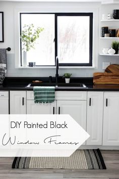 a kitchen with white cabinets and black counter tops, the words diy painted black written on it