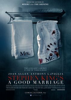 two white towels hanging on a rack in front of a mirror with the words stephen king's a good marriage