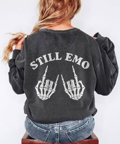 still emo, elder emo, elder emo shirt, when we were young, emo clothing, rock and roll shirt, it wasnt a phase, emo gifts, gift for emo Printed on Comfort Colors Unisex Crewneck Sweatshirts! 👕 Comfort Colors Brand: Unmatched luxurious comfort and style with this unisex, garment-dyed sweatshirt. 🌈 Color-Blast Fleece: Crafted with 80% ring-spun cotton and 20% polyester, featuring 3-end garment-dyed, ring-spun, color-blast fleece with a 100% cotton face. 👉 Relaxed Fit: Enjoy a relaxed fit and a rolled-forward shoulder for maximum comfort and style. 🏷️ Sewn-in Twill Label: High-quality finish to complement the overall look and feel. 👗 1x1 Ribbed Collar, Cuffs, and Bottom Hem: Stretchy yet snug, providing a well-fitted garment. * DUE TO THE COMFORT COLORS GARMENT DYE PROCESS, COLORS MAY AP Emo Letter Print Sweatshirt For Streetwear, Black Punk Style Sweatshirt For Concert, Black Emo Sweatshirt With Graphic Print, Punk Style Black Sweatshirt For Concert, Black Grunge Sweatshirt For Concert, Emo Crew Neck Sweatshirt For Streetwear, Black Punk Sweatshirt With Letter Print, Black Emo Sweatshirt With Letter Print, Punk Letter Print Sweatshirt For Concert