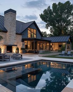 a house with a swimming pool in front of it