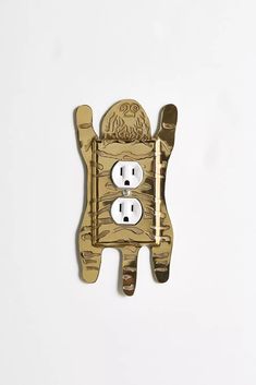 an electrical outlet in the shape of a dog