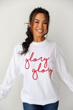 COMFORT COLORS All DU Exclusive items are excluded from all coupons and promotions Get ready for game day with the Glory Glory Script Long Sleeve Tee! This comfy tee is designed with a soft and stretchy knit. It features a crew neckline, long sleeves, a relaxed fit, and the words "Glory Glory" on the front. Style the Glory Glory Script Long Sleeve Tee with your favorite denim and sneakers for a cute game day look! Comfort Colors Soft + Stretchy Knit Fabrication "Glory Glory" Graphic Crew Necklin Exclusive Dress, Cute Games, The Glory, Large Bust, Comfy Tees, Small Bust, Long Sleeve Tee, Black Tee, Comfort Colors