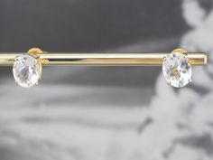 Icy sparkles and bright flashes of light gleam from the edges of these white topaz studs! Set in simple, attractive stud earring mountings, these are easy to transition from day to evening, and wear on any occasion! Metal: 14K Yellow Gold Gem: 2 White Topaz totaling 6.27 Carats Gem Measurements: 10.0 x 8.1 mm, Oval Earrings Length: 10.0 mm Earrings Width: 8.1 mm Marks: "14K S" Stamped on the Findings Luxury White Topaz Elegant Earrings, White Gold Drop Earrings, Oval Earrings, Blue Topaz Pendant, Diamond Cocktail Rings, Oval Earring, Diamond Drops, Gold Drop Earrings, Drop Pendant