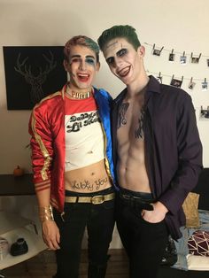 two men in costumes posing for a photo