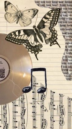 an old sheet with music notes and butterflies on it, as well as a vinyl record