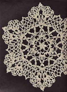 an image of a white doily on a black background