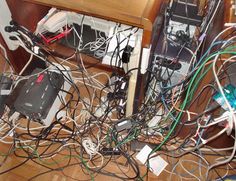 many wires are tangled up on the floor