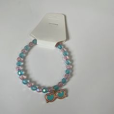 This Is A Handmade Pink And Blue Bracelet With A Little Sunglasses Charm. This Would Be Great For Little Girls. Pink Plastic Bracelets For Beach, Pink Plastic Beach Bracelets, Adjustable Pink Glass Bracelets, Cute Blue Beaded Bracelets For Birthday, Cute Blue Bracelet For Birthday, Pink Plastic Jewelry For The Beach, Cute Blue Bracelets For Party, Trendy Pink Glass Jewelry, Trendy Blue Beaded Bracelets For Birthday