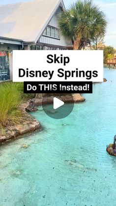 a small boat floating on top of a lake next to a building with the words skip disney springs do this instead