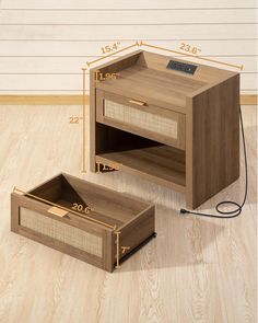 the side table is made from wood and has an open drawer on one side, with measurements for each drawer