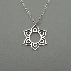 "Sterling silver Lotus Mandala necklace on a sterling silver chain. The Mandala pendant measures 6/8\" tall. All jewelry parts are 925 solid sterling silver. Send jewelry gifts direct with free gift box and note. Available in 16\", 18\" (model shown), 20\" Gift Box Included Short gift note may be added at checkout. Receipts not included. For multiple orders needing separate gift boxes, mark as gifts or only 1 gift box will be included. Add a Charm or Gemstone https://tinyurl.com/y8ghk8oa About Q Bohemian Sterling Silver Jewelry With Flower Charm, Minimalist Sterling Silver Necklaces For Meditation, Bohemian Sterling Silver Charm Necklaces In Silver, Nickel-free Silver Charm Necklaces For Meditation, Spiritual Silver Jewelry With Flower Charm, Sterling Silver Necklace For Meditation, Sterling Silver Pendant Necklace For Meditation, Spiritual Sterling Silver Necklace With Flower Charm, Sterling Silver Spiritual Necklace With Flower Charm