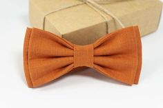 Burnt Orange color bow tie Fashion forward and progressive style, ideal for weddings, proms, casual events. Handmade bow tie from natural fabric - is always a perfect addition to wedding outfit._________________________________________IMPORTANT:We work hard on our PHOTOS to make sure you know what the product looks like. However due to different monitors, screens, monitor settings or even eyes we cannot guarantee that color will match 100%. If you wan`t to check if color fit`s your needs you can Toddler Bow Ties, Green Bow Tie, Groomsmen Ties, Tie Fashion, Orange Bows, Kids Bow Ties, Boys Bow Ties, Toddler Bows, Bow Tie Wedding