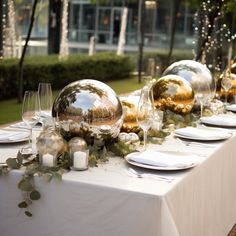 the table is set with silver and gold decorations