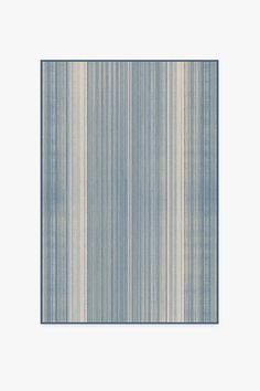 a blue and white rug with vertical stripes