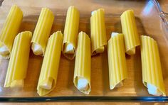 four pieces of uncooked pasta on a baking sheet