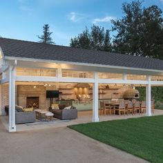 a covered patio area with furniture and lights