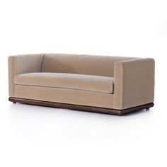 Our Paris Velvet Sofa offers a refined take on classic Art Deco style. Crafted with an exquisite parawood plinth base and a luxuriously smooth taupe velvet upholstery, it will bring a sophisticated, timeless feel to any living space. PREORDER: More stock expected Mid February. We will fulfill your order as soon as this item becomes available! Overall Dimensions: 83.00" W | 35.00" D | 29.00" H Taupe Sofa, Modern Brands, Mesa Exterior, Kathy Kuo Home, Sofa Sale, Upholstered Sofa, Polyurethane Foam, Modern Sofa, Brown Wood