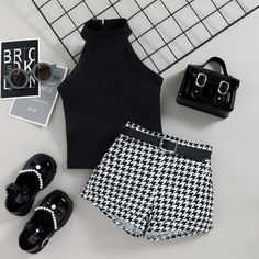 Elevate your little one's summer style with our charming High Neck Sleeveless Top and Plaid Shorts Set – a perfect blend of fashion and comfort! The high neck sleeveless top, in its elegant design, offers a touch of sophistication while keeping your child cool on warm summer days. The sleeveless cut allows for easy movement, while the high neckline adds a trendy twist to this classic look. Paired with the top are matching plaid shorts that effortlessly capture a playful and stylish vibe. The pla Summer Sleeveless Tank Top For Playwear, Summer Sleeveless Playwear Sets, Black Summer Playwear Tops, Playful Black Shorts For Summer, Sleeveless Black Sets For Spring, Black Summer Sets For Playwear, Stretch Black Sets For Summer, Black Stretch Sets For Summer, Black Stretch Summer Sets